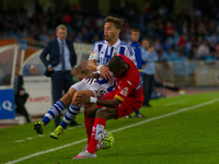 Sergio Canales (L) of Real Sociedad duels for the ball with P. Diop (R) of RCD Espanyol during the Spanish league football match Real Socied...