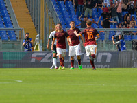 Roma’s forward Francesco Totti  celebrates after scoring a goal 1-1with teammates  during the Italian Serie A football match A.S. Roma vs U....