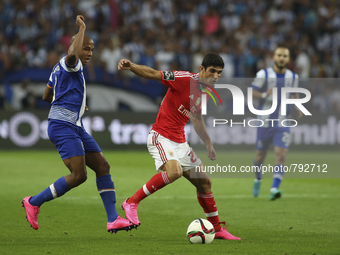 Porto's Algerian forward Yacine Brahimi and Benfica's Portuguese forward Gonçalo Guedes in action during the Premier League 2015/16 match be...