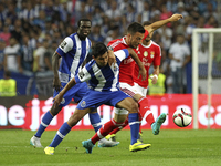 Porto's Mexican forward Jesús Corona (L) vies with Benfica's Greek midfielder Andreas Samaris (R) during the Premier League 2015/16 match be...