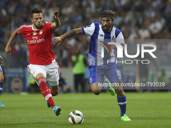 Benfica's Greek midfielder Andreas Samaris and Porto's Itaian forward Pablo Osvaldo in action during the Premier League 2015/16 match betwee...