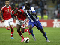 Porto's Cameroonian forward Vincent Aboubakar (R) vies with Benfica's Portuguese defender Nelson Semedo (L) during the Premier League 2015/1...