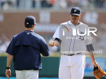 Detroit Tigers starting pitcher Alferdo Simon is pulled by manager Brad Ausmus during the fifth inning of a baseball game against the Kansas...