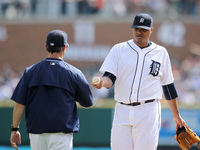 Detroit Tigers starting pitcher Alferdo Simon is pulled by manager Brad Ausmus during the fifth inning of a baseball game against the Kansas...