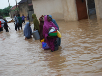 People displaced by heavy flooding in Kapala shooting range area of Kaduna State on monday, 21th September 2015, after heavy rainfall early...