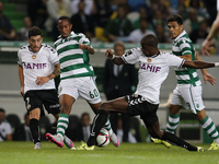Sporting's forward Gelson Martins (C) vies for the ball with Nacional's defender Ali Ghazal (R) and Nacional's forward Salvador Agra (L)  du...
