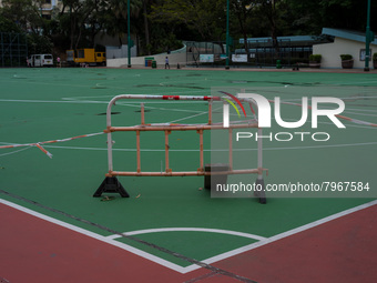 Makeshift barriers cordon off a football pitch in Kwun Tong, in Hong Kong, China, on March 24, 2022.  (
