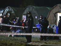Hundreds of migrants awaiting to enter to the transfer camp in Opatovac near the border crossing point between Serbia and Croatia, on Septem...