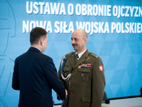 Polish National Defence Minister Mariusz Blaszczak and Colonel Miroslaw Brys during the conference 