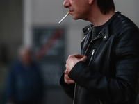 A man smokes a cigarette in Krakow, Poland on March 28, 2022. (