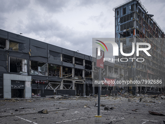 Shelling in a Kyiv neighbourhood has devastated a shopping centre, leaving a flattened ruin. Eight people were killed as a result of this sh...