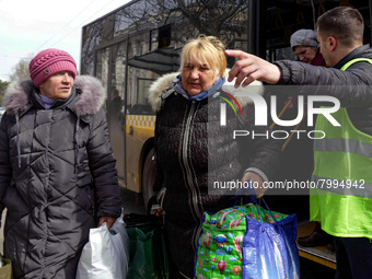 ODESA, UKRAINE - MARCH 29, 2022 - Evacuees from Mykolayiv get off the bus upon arrival to Odesa, southern Ukraine (