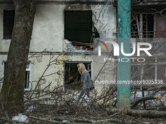 A woman walks with her belongings surrounded of the destruction after a russian shelling the previous night in Kharkov, Ukraine. (