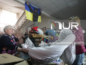 Ukrainian volunteers work at the city humanitarian volunteer center for helping refugees, amid Russia's invasion of Ukraine, at the city of...