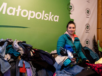A Ukrainian refugee searches for clothes in PSL office in Krakow, Poland where U-Work Foundation provides free goods for war escapees as  mo...