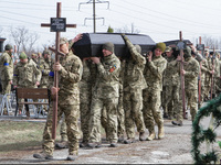 DNIPRO, UKRAINE - APRIL 1, 2022 - Servicemen carry the coffins during the funerals of soldiers killed during the Russian invasion of Ukraine...