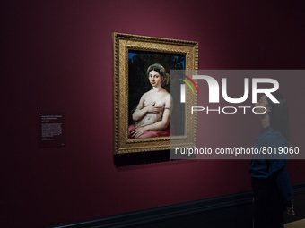 LONDON, UNITED KINGDOM - APRIL 04, 2022: (EMBARGOED UNTIL 0001 BST ON WEDNESDAY 06 APRIL 2022) A gallery staff member looks at 'Portrait of...