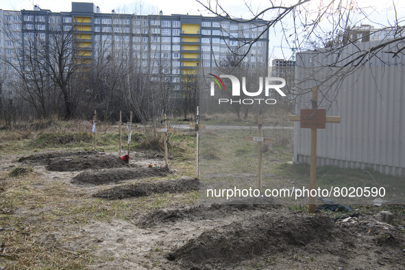 Graves with bodies of civilians next to apartments blocks in the recaptured by the Ukrainian army Bucha city near Kyiv, Ukraine, 04 April 20...