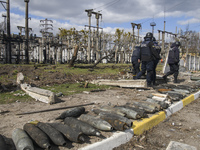 Ukrainian Sapers dispers explosive items and shells in the recaptured by the Ukrainian army Bucha city near Kyiv, Ukraine, 04 April 2022. (