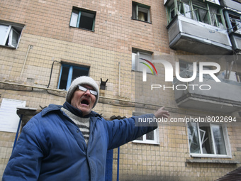 Local resident shows his windows in Residential building Destroyed by Russian army in the recaptured by the Ukrainian army Borodyanka city n...