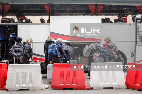Ukrainian refugees board a coach at the Medyka Ukrainian-Polish border as they travel with the Abdar travel agency from Lviv to Krakow, Pola...