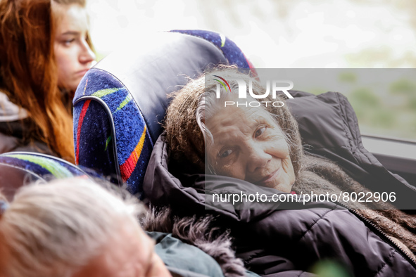A Ukrainian elderly refugee  sits in a coach of Abdar Polish travel agency in Lviv, Ukraine as they depart for Krakow, Poland on April 5, 20...
