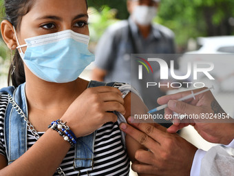 A health system personnel applies a dose of anti-Covid-19 vaccine to a child in the La Parada sector, near the city of Cucuta on the Colombi...