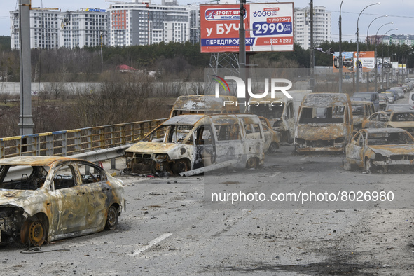 Burnt cars on a destroyed bridge near the recaptured by Ukrainian forces city of Irpin, Ukraine, 06 April 2022 