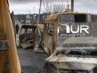 Burnt cars on a destroyed bridge near the recaptured by Ukrainian forces city of Irpin, Ukraine, 06 April 2022 (