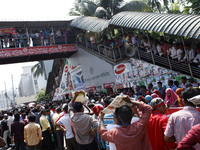 Garment workers take part in a rally in front of press club organized by United Federation of Garment Workers in Dhaka, on April 11, 2014 de...