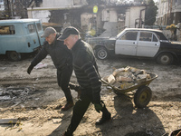 People cleaned on the streets in Irpin city, which was the recaptured by the Ukrainian army, Kyiv area, Ukraine, 07 April 2022 (