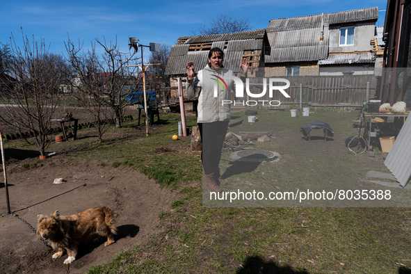 BUCHA, UKRAINE - APRIL 7, 2022 - Local resident Tetiana shows around the plot surrounding her house after the liberation of the city from Ru...