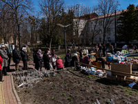 BUCHA, UKRAINE - APRIL 7, 2022 - People queue to receive humanitarian aid after the liberation of the city from Russian invaders, Bucha, Kyi...