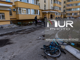 BUCHA, UKRAINE - APRIL 7, 2022 - People are gathered in the yard of an apartment building after the liberation of the city from Russian inva...