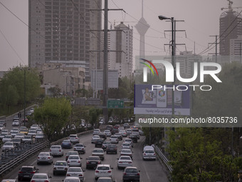 Vehicles drive along an expressway in Tehran during a polluted air, on April 8, 2022. (