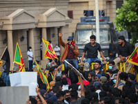Sri Lankans held national flags and placards protesting on April 9, 2022, in front of the  Presidential Secretariat office in Galle Face, Co...