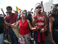 Sri Lankans held national flags and placards protesting on April 9, 2022, at Galle Face, Colombo. They are protesting, demanding the preside...