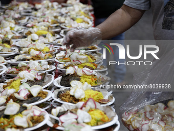Administrators of Dharma Bhakti Temple and chinese residents, prepares iftar meals for Muslims during the holy month of Ramadan, in Jakarta,...
