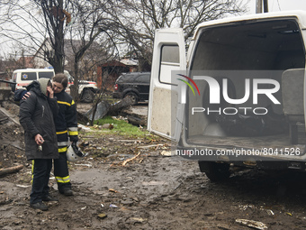 A woman crying next to a body of a person found under the rubble after the collapse of buildings destroyed by russian army in Borodyanka cit...