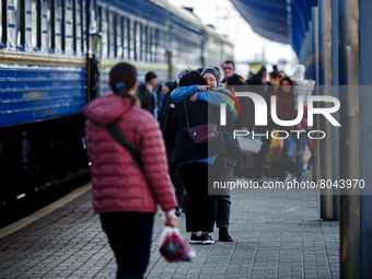 UZHHORORD, UKRAINE - APRIL 08, 2022 - People hug at the railway station of Uzhhorod, western Ukraine (