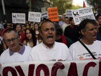 Demostrators shout slogans during a protest in Madrid, Spain, Thursday, April 10, 2014. Hundreds of protestors gathered to demand freedom fo...