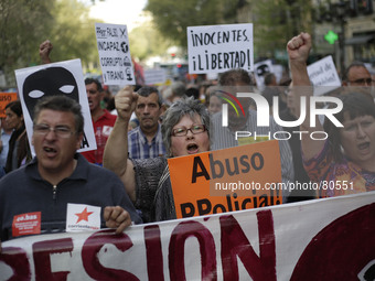 Demonstrators shout slogans during in Madrid, Spain, Thursday, April 10, 2014. Hundreds of protestors gathered to demand freedom for fellow...