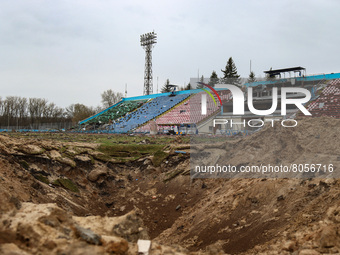 CHERNIHIV, UKRAINE - APRIL 9, 2022 - A huge crater is pictured on the pitch of the Chernihiv Olympic Sports Training Centre (formerly Yuri G...