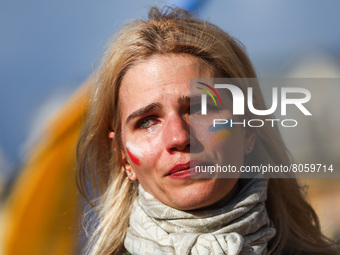A woman cries while attending 'Mothers' March' as part of Stand with Ukraine international protest, in Krakow, Poland on April 10, 2022. Ukr...