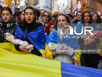People attend 'Mothers' March' as part of Stand with Ukraine international protest, in Krakow, Poland on April 10, 2022. Ukrainian mothers a...