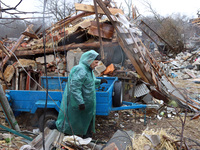 NOVOSELIVKA, UKRAINE - APRIL 9, 2022 - A local resident examines the ruins of a private house after the liberation of a town from Russian in...