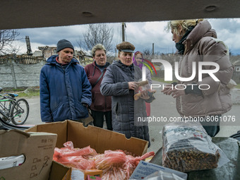 Volunteers give humanitarian assistance to the civilians who suffered the most intense russian shelling in Novoselivka, outskirts of Chernih...