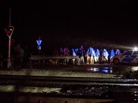 Refugees crossing the border at night between Hungary and Austria, in Nickelsdorf, on September 26, 2015. Conciliation replaced confrontatio...