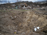 . NOVOSELIVKA, UKRAINE - APRIL 11, 2022 - A crater left from Russian shelling is pictured in liberated Novoselivka village, Chernihiv Region...