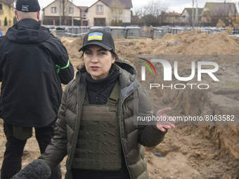 Prosecutor General of Ukraine Iryna Venediktova speaks to journalists close to a mass grave in Bucha, Kyiv area, Ukraine, April 12, 2022 (
